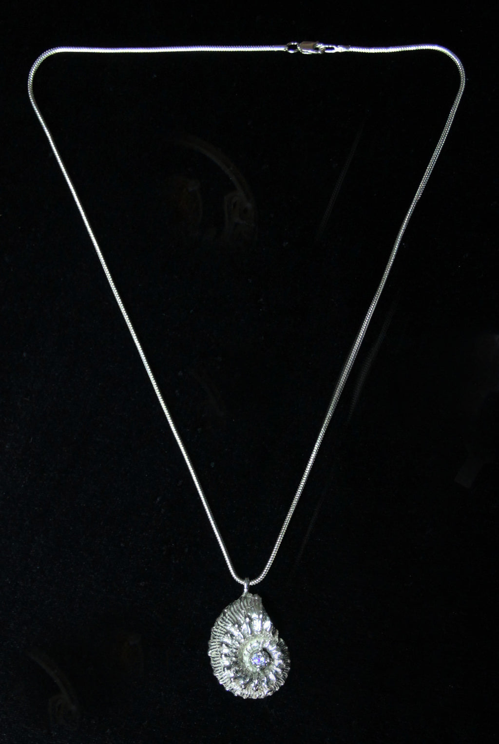 Ammonite fossil and cubic zirconia pendant