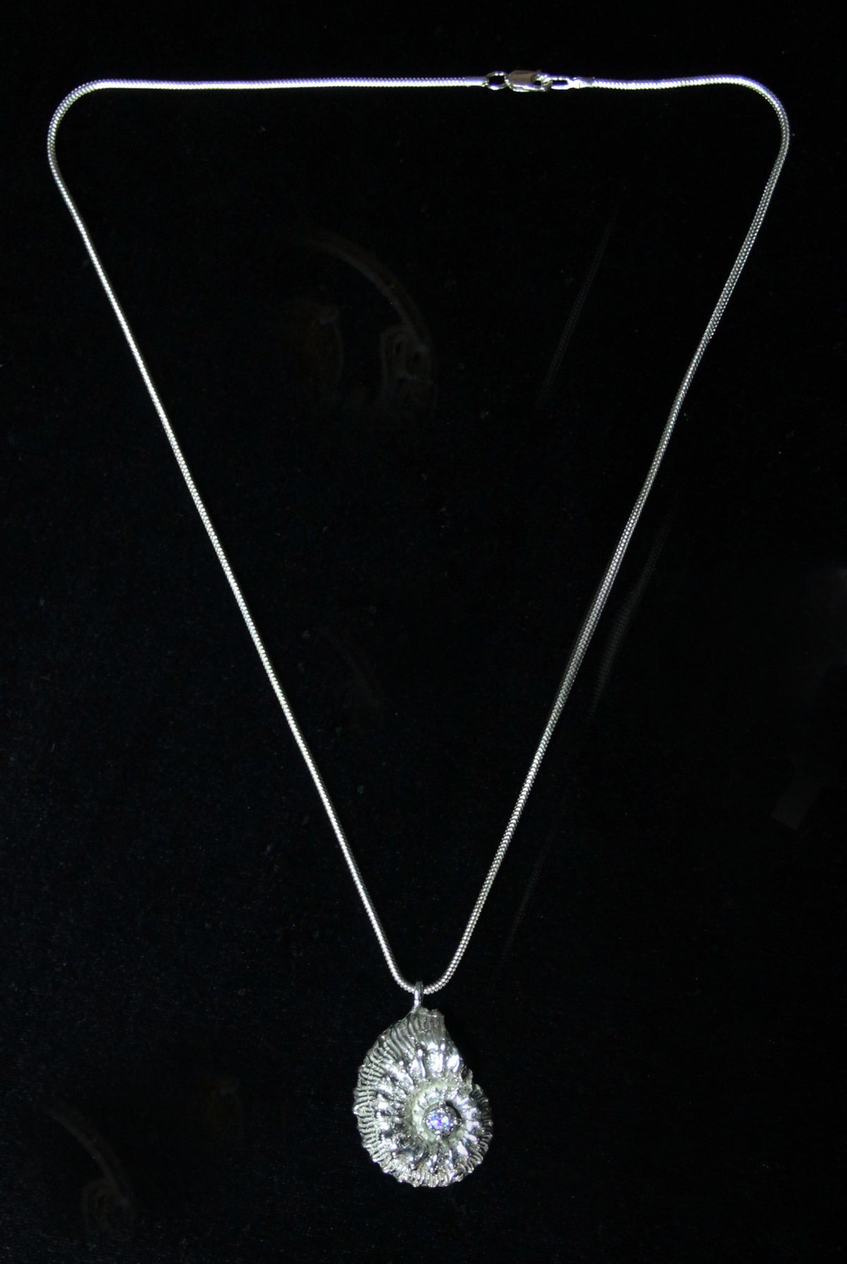 Ammonite fossil and cubic zirconia pendant
